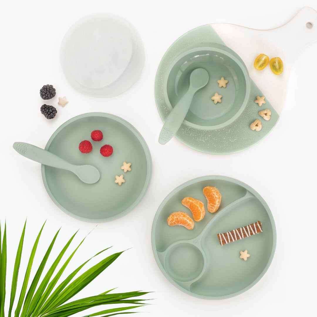 Brightberry best-selling self-feeding set in Sage, suction bowl with lid, easy-scooping suction plate and divided plate, with fruit snacks.