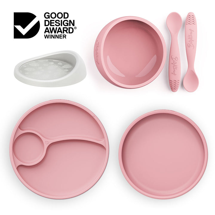 Brightberry Australia by Design Feeding Set in coral pink, featuring a suction bowl with a new airtight lid, divided and non-divided plates, and two ergonomic spoons, now gift-packed and award-winning. As seen on Channel 10's Australia by Design: Innovations.