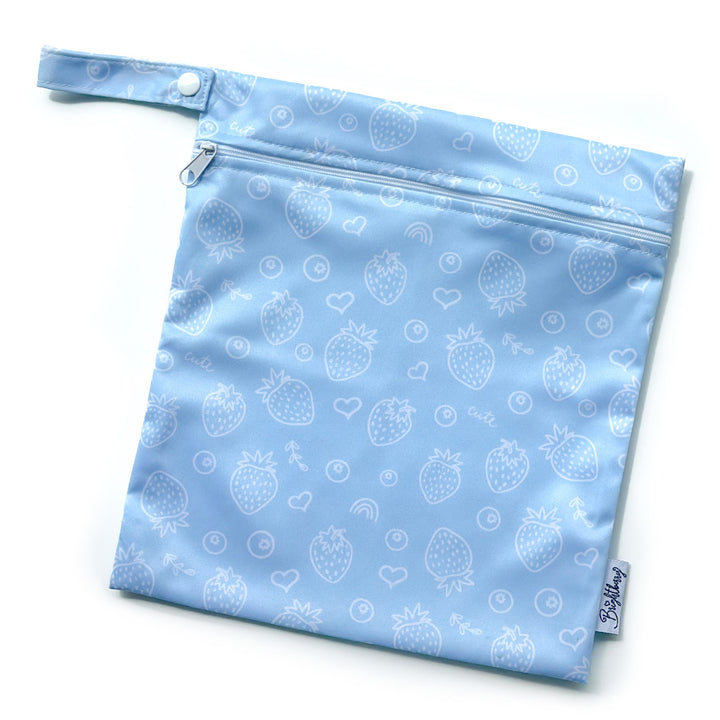 Pacific light blue waterproof bag with white strawberry print, zip closure and snap-button carry handle.