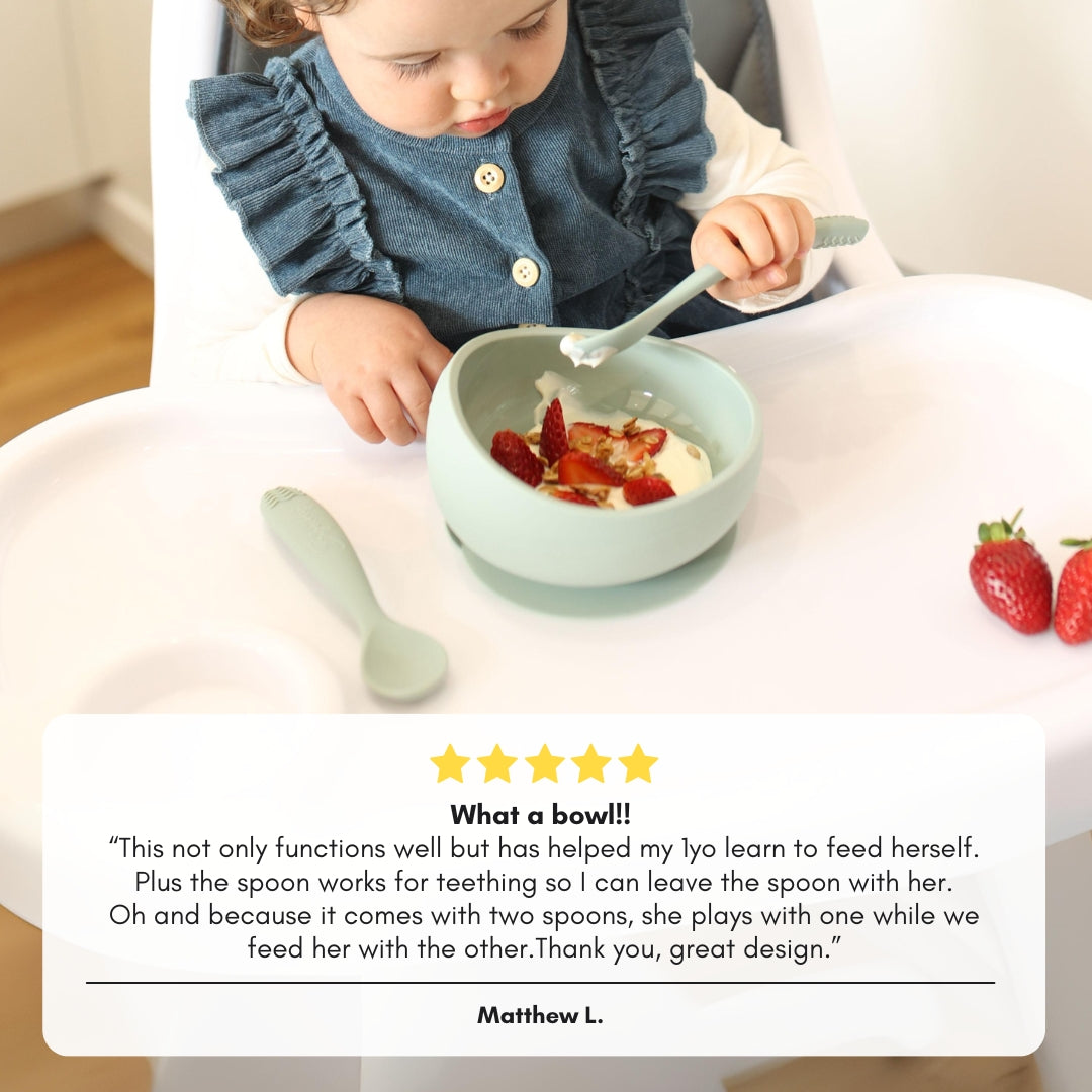 customer testimonial about Brightberry suction bowl set over the photo of a toidler girl feeding herslf from silicone bowl with silicone spoon