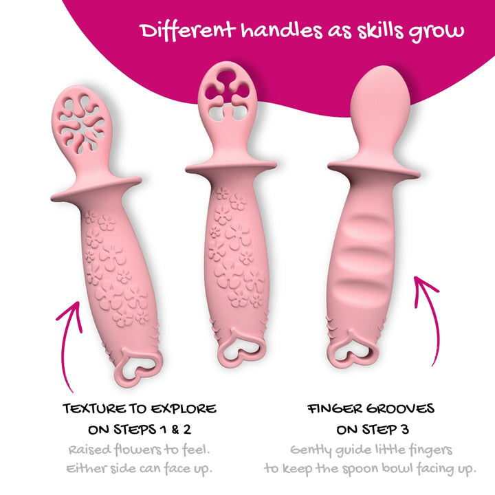 Three pink baby feeding utensils with explanatory text and arrows. The top text reads 'Made for little hands,' and the bottom text describes flower texture exploration on dipping spoons and finger grooves guidance on the first spoon.