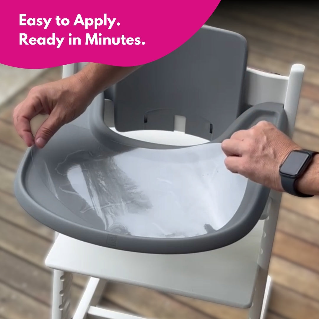 Hands installing a brightberry suction sticker on a Stokke Tripp Trapp tray with water application method.