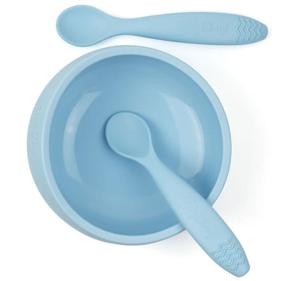 Brightberry's large light pink Pacific suction bowl accompanied by two matching silicone spoons, designed for self-feeding infants and toddlers, promoting mess-free and independent mealtime.