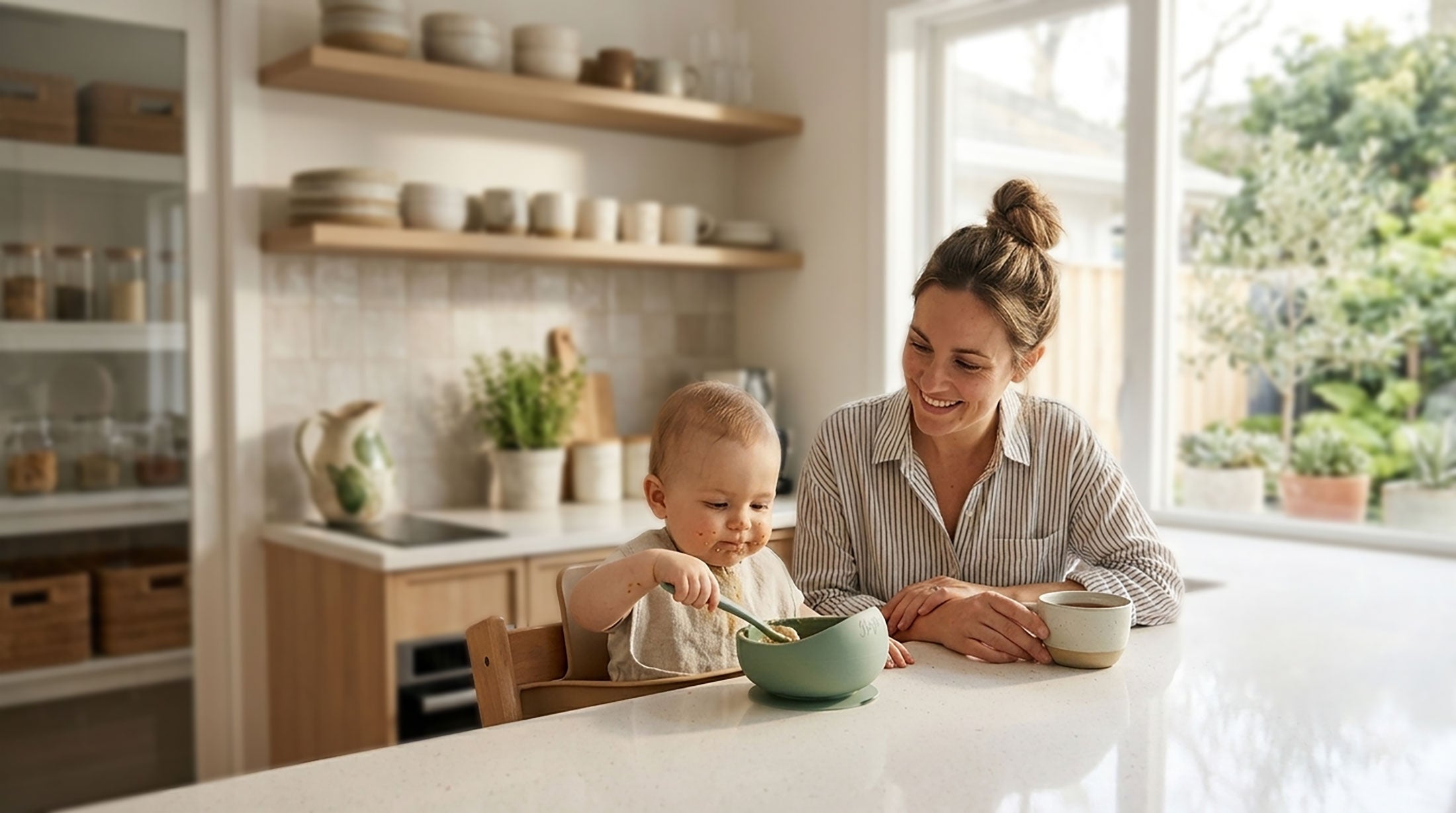 Woman and child in a kitchen with bowls and a spoon