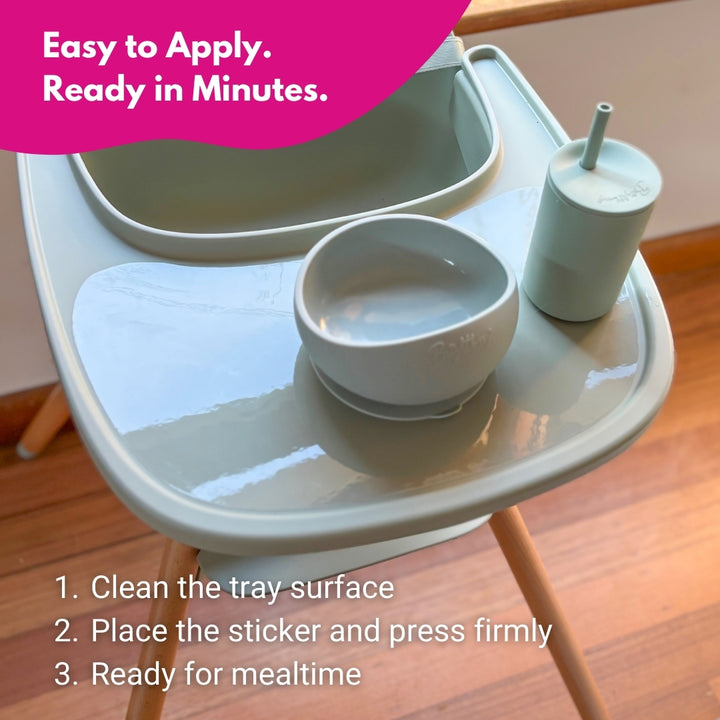 Children's Redsbaby Hilo2 high chair tray with bowls and a cup on a suction sticker, with text about ease of application.