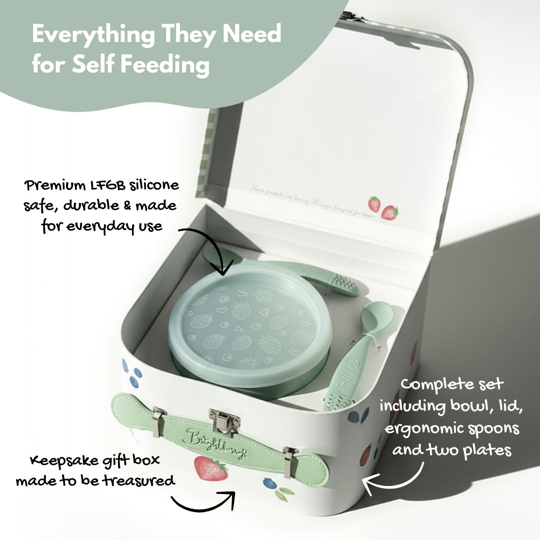 Gift Box Set of self-feeding items, including a bowl, lid, spoons, and plates in a keepsake gift box.