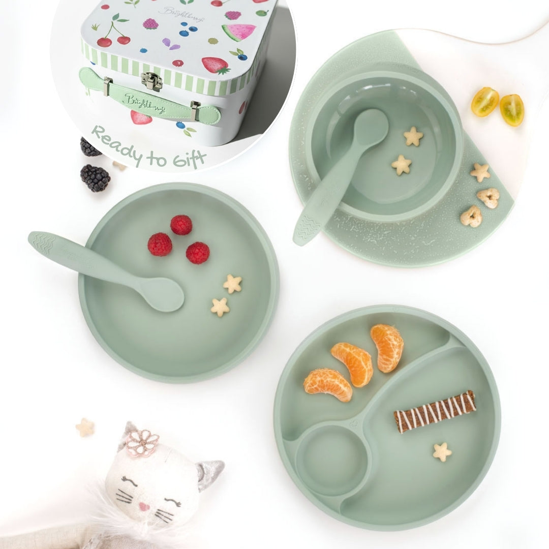 Children's dining set in sage with plates, bowls, and utensils presented in a giftbox