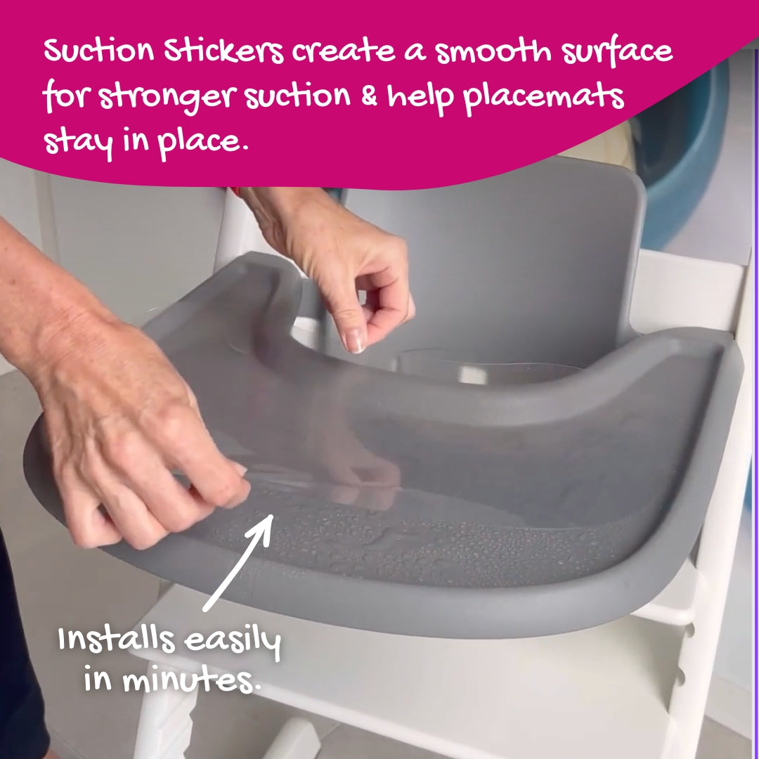 Brightberry Suction Sticker being applied to a Stokke Tripp Trapp tray, showing how it creates a smooth surface for stronger suction and helps placemats stay in place.