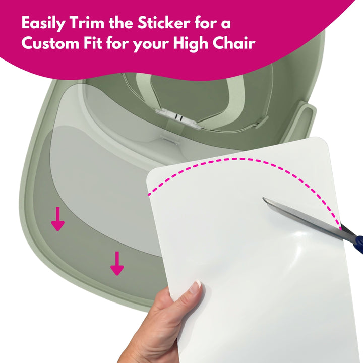 Cutting clear suction sticker to custom fit a high chair tray shape.