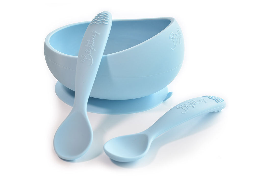 Silicone suction bowl with suction base and two ergonomic silicone spoons in light blue colour