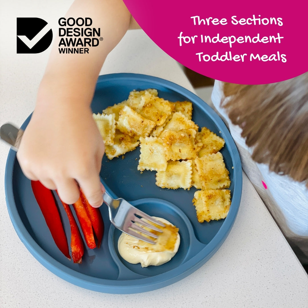 Toddler eating ravioli and capsicum from a blue Brightberry theValle divided suction plate with text overlay and good design award winner logo