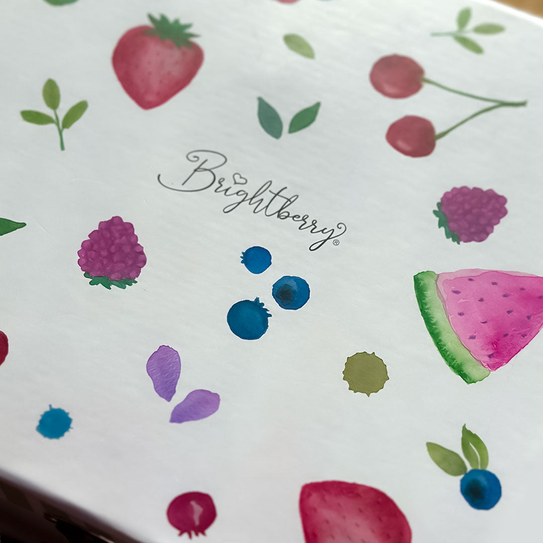 Product packaging with fruit illustrations and 'Brightberry' branding.