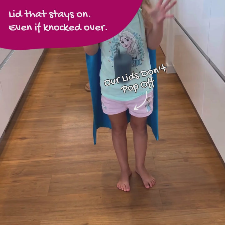 Brightberry silicone smoothie cup knocked over on floor showing secure lid stays on with no smoothie spills