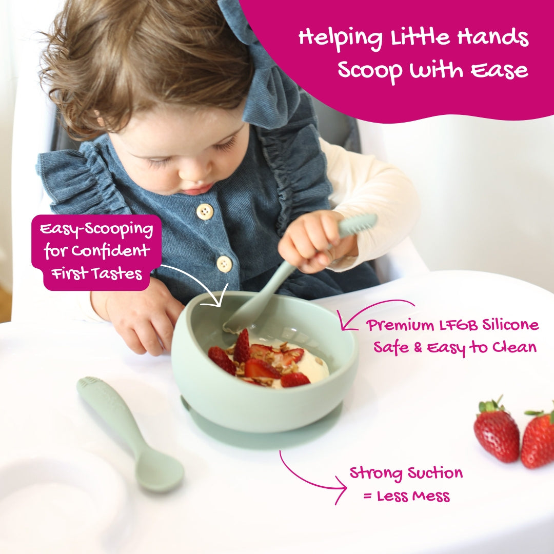 Baby learning to self-feed using Brightberry suction bowl and ergonomic spoon, featuring easy-scooping design, strong suction, and premium LFGB silicone.